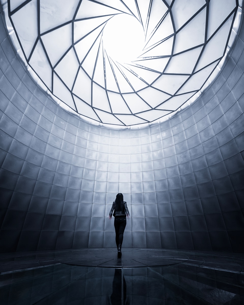 woman wearing black shirt facing the ceiling